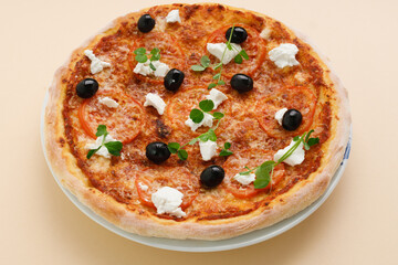 homemade pizza with tomatoes, olives and young cheese.