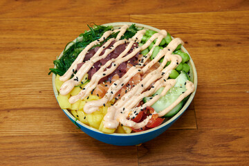 Set of fresh poke bowl with salmon, avocado, chukka, basil,shrimp and smoked fish on red background