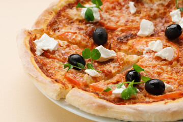 homemade pizza with tomatoes, olives and young cheese.