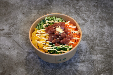 Set of fresh poke bowl with salmon, avocado, chukka, basil,shrimp and smoked fish on red background