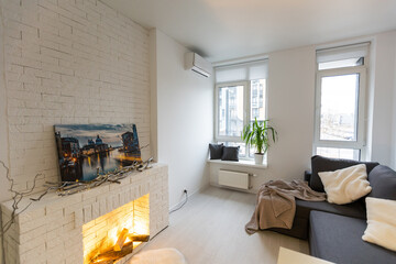 Bright living room interior with fireplace