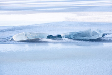 Texture of winter ice surface. Blue natural ice background.