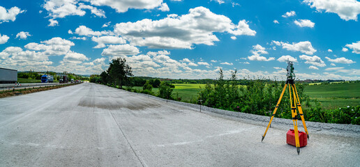 Surveyors equipment (theodolite or total positioning station) on the construction site of the road, highway or building