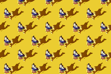 Trendy pattern made with figure of a camel with a driver, a Bedouin. Silhouette of camel caravan in the desert sand during sunrise. Cameleer with camels caravan, silhouettes and shadows.