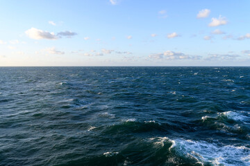 Beautiful seascape - waves and sky with clouds with beautiful lighting.