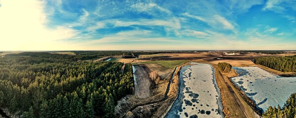 Panorama.Aerial view of fish ponds on a sunny day among the fields and forest of the Polish...