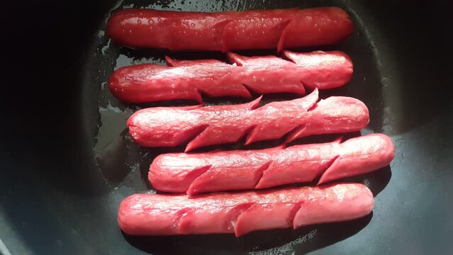 Video image of homemade hot dogs in the pot