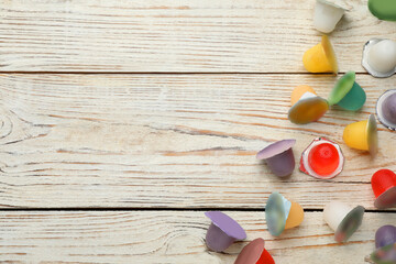 Tasty bright jelly cups on white wooden table, flat lay. Space for text