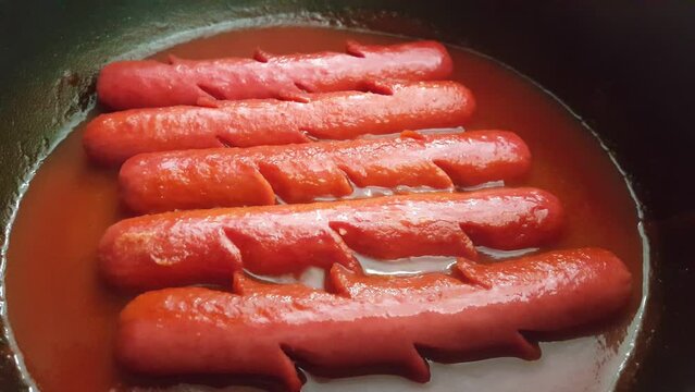Video image of homemade hot dogs in the pot
