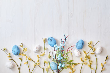 Willow branches and decorations, easter eggs on a light background. Happy easter flat lay concept
