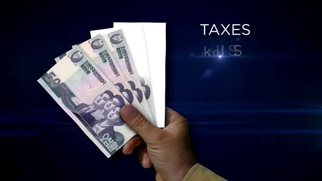 North Korea Won paper note holding. Fan of KPW banknotes in hand. Metaphor concept of income loss, cost of live, tax, credits and money decline.