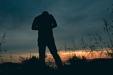 silhouette of a man on sunset