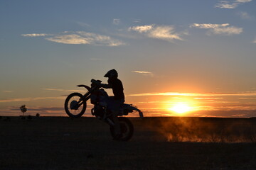 Fototapeta na wymiar wheelie at sunset