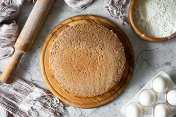 Sweet dessert: an airy chocolate cake sponge cake on a gray background. Top view