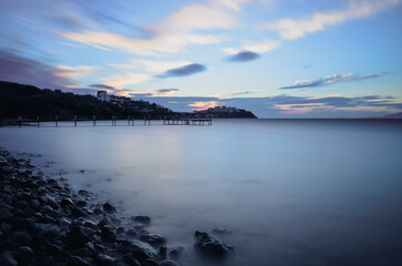 sunset over the sea long exposure rocks