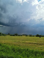 Fototapeta premium clouds over the field