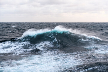 Seascape, blue sea. Windy weather. View from vessel. Waves at sea. Storm.