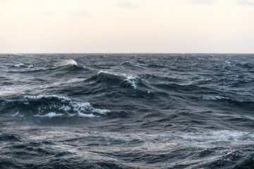 Seascape, blue sea. Windy weather. View from vessel. Waves at sea. Storm.