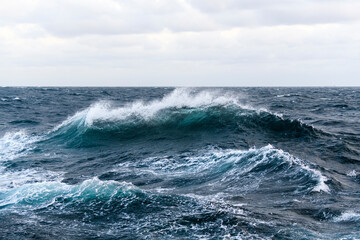 Seascape, blue sea. Windy weather. View from vessel. Waves at sea. Storm.