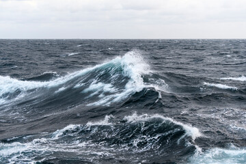 Seascape, blue sea. Windy weather. View from vessel. Waves at sea. Storm.