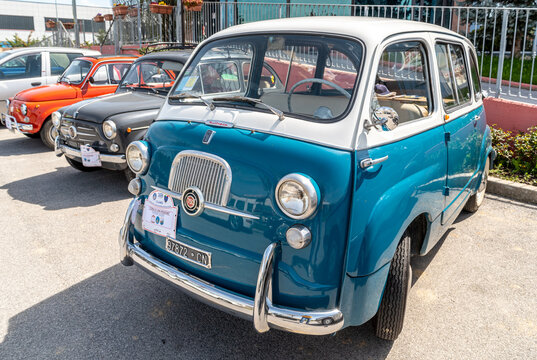 Benevagienna, Cuneo, Italy - April 10, 2016: Fiat 750 multipla (1963) vintage car with Fiat 600 e Fiat 500 on background during a meeting of historic cars.