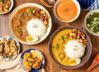 Signature Beef Spice Curry rice, Cilantro Chicken Spice Curry rice, pumpkin soup, Yuan fried chicken, fried Mushrooms with Mixed Spices and garlic and Seaweed Soup chinese food set table top view