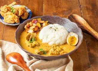 Tasty dinner with Cilantro Chicken Spice Curry rice in bowl on wooden background top view chinese food
