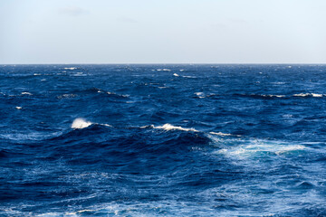 Fototapeta premium Beautiful seascape - waves and sky with clouds with beautiful lighting. Caribbean sea. Mediterranean sea.