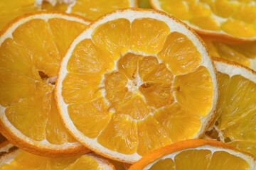 Cross-section of the dried oranges slices showing the pattern of the flesh. Food background