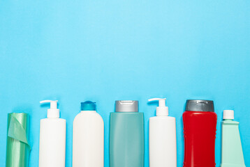 Detergent for various surfaces in the kitchen, bathroom and other rooms. Close-up. Light pastel blue background. Professional cleaning products, general cleaning. Household chemicals