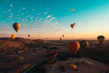 Amazing wide view of many balloons during takeoff in luxor egypt. Early morning hours as hot air...