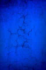 Cracked wall in blue