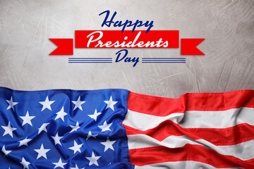 Happy President's Day - federal holiday. American flag and text on grey stone background, top view