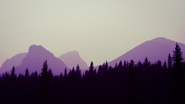 Smokey outline of mountains on the horizon of a Canadian mountain range.