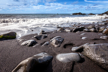 Black sand beach along the road to Hana in Maui, Hawaii