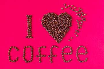 I love coffee. Romantic composition with coffee beans on a red background