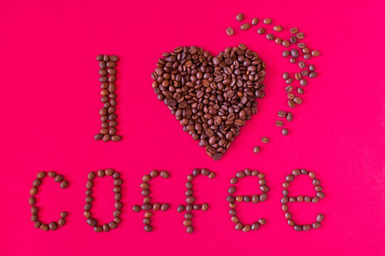 I love coffee. Romantic composition with coffee beans on a red background