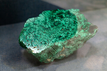 a large piece of African malachite in a display case