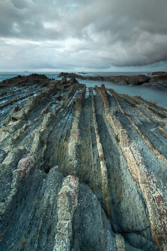   Flysch of Saturraran beach in the village of Mutriku. Perfect and beautiful view of the famous flysch of the Basque Country. Very touristic and geologically very important area.
