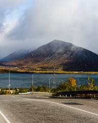 road in the mountains around the lake