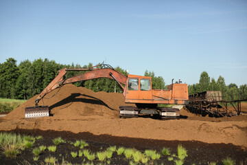 Special equipment for collecting peat. Peat extraction process. Agriculture industry, peat farm