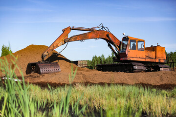 Special equipment for collecting peat. Peat extraction process. Agriculture industry, peat farm