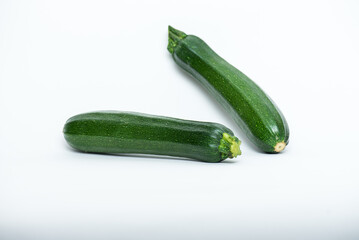 Two courgettes isolated on the white background.