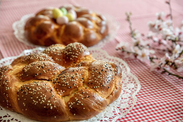 Easter sweet bread, greek tsoureki, brioche braid on table, close up view