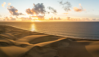 Landscape with golden sand dunes at sunrise in Maspalomas, Gran Canaria, Canary Islands, Spain