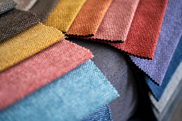 Colorful upholstery fabric samples on the home sofa