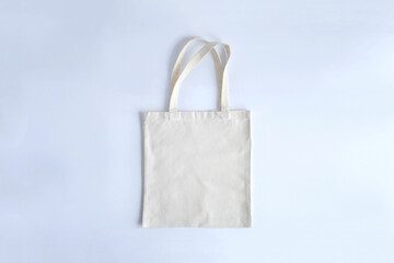 Canvas tote bag. Mockup.Reusable grocery shopping bag with copy space.Beige eco bag mockup.Eco friendly concept. Zero waste.Think green.Top view.
