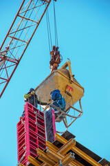 Fototapeta premium Construction formwork, reinforcement for the construction of buildings. Workers make a concrete structure