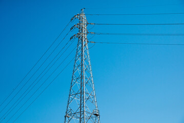 Electric Pole Power Lines And Wires With Blue Sky Background