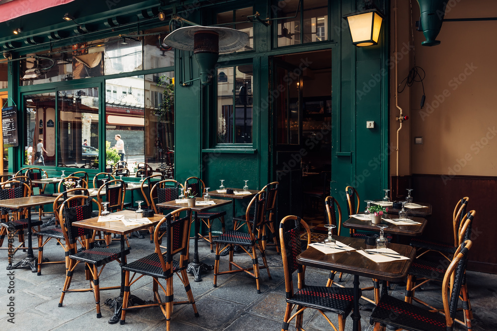 Wall mural typical view of the parisian street with tables with tables of cafe in paris, france. architecture a